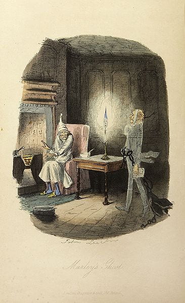 A book illustration featuring a man with grey hair in a nightgown and nightcap. He's sitting by a large fireplace and a ghost with shackles is walking toward him. Underneath are the words "Marley's Ghost."