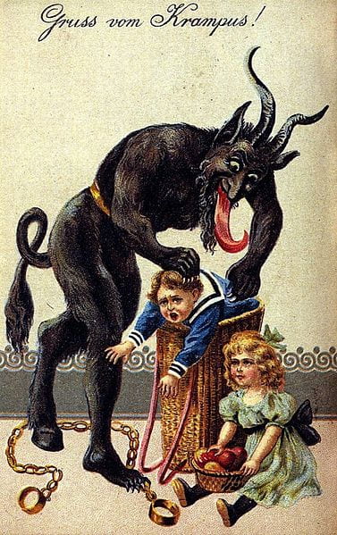 A dark goat-like figure standing upright with horns, tail, one hooved food and a very long tongue is putting a little boy in a basket while a little girl looks on and holds a basket of apples. Above them are the words: "Gruss vom Krampus!"