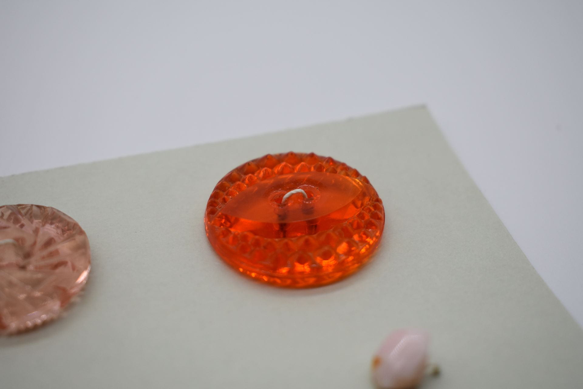 A transluscent bright orange button.