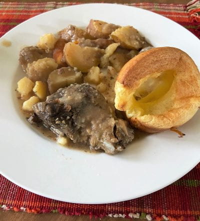 Pot roast and yorkshire pudding served on a plate