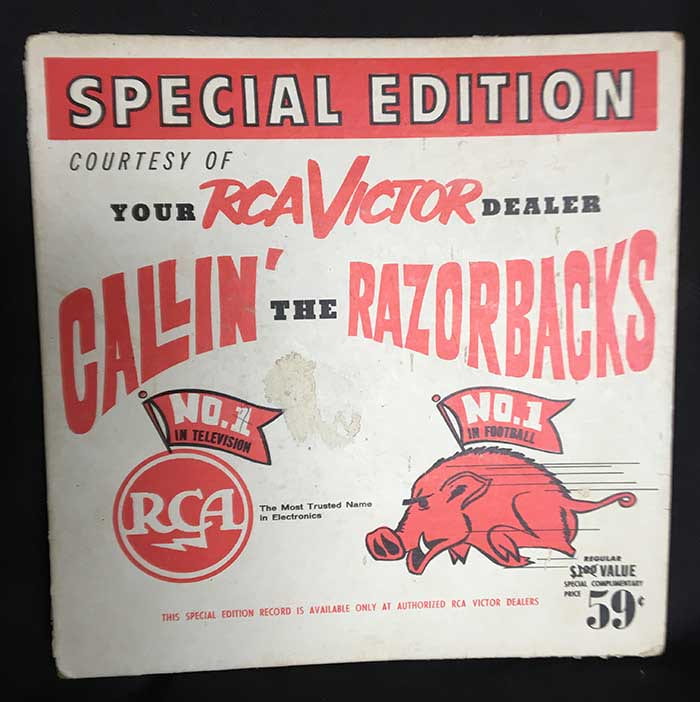 A white record album that says "Special Edition Courtesy of Your RCA Victor Dealer Callin' the Razorbacks." Has a running Razorback illustration and an RCA label underneath the text.