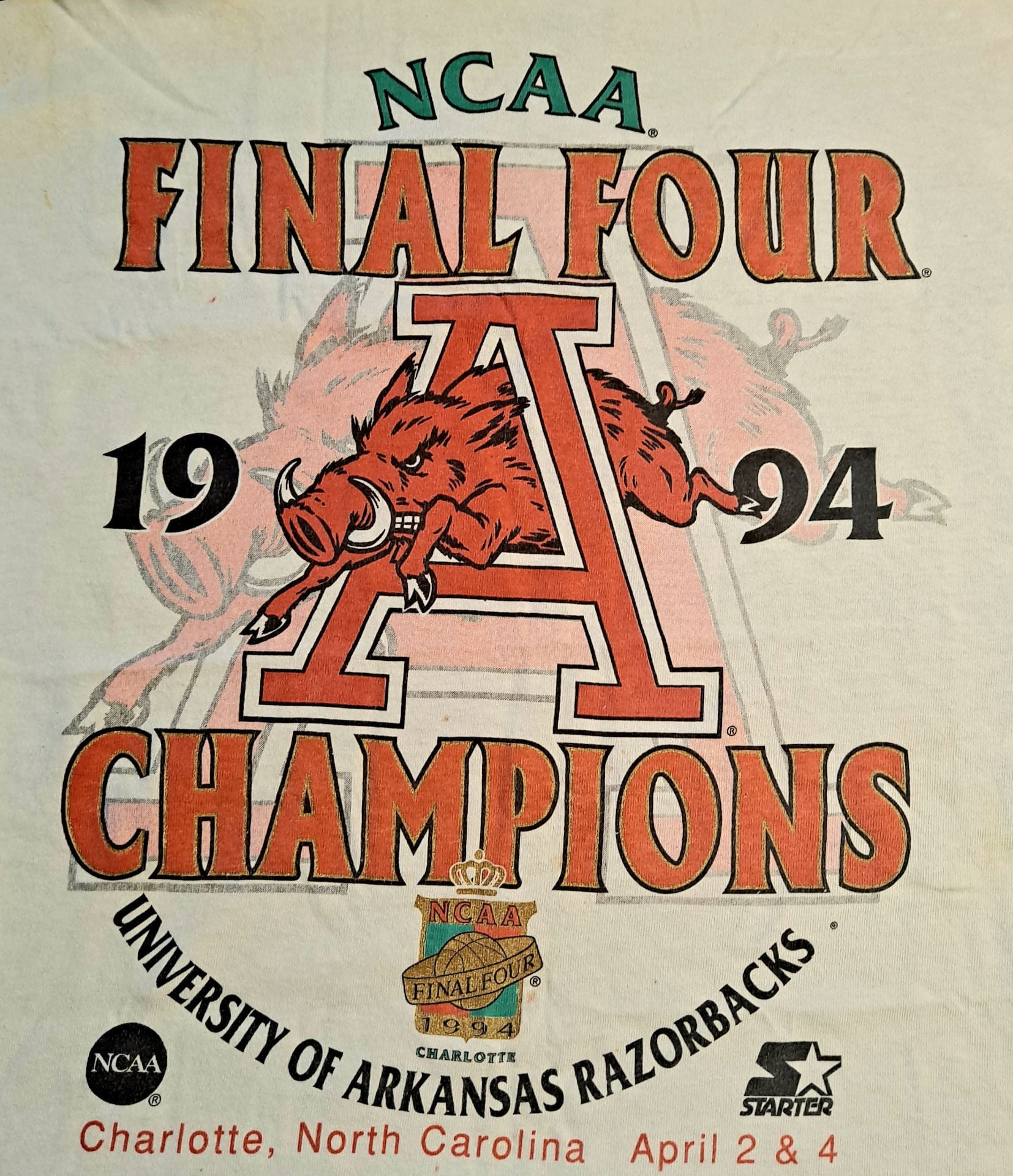 Close-up of a t-shirt that says "NCAA Final Four Champions University of Arkansas Razorbacks 1994."